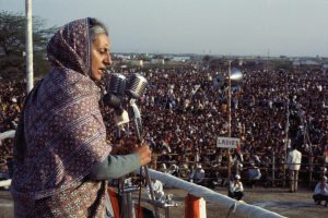 Indira Gandhi speaking to a crowd scaled