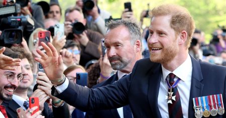 Prince Harry looks stunned and delighted by the turnout