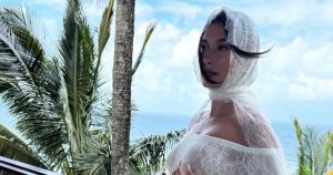 feature Pregnant Hailey Bieber Cradles Baby Bump in New Photo From Stunning Maternity Shoot