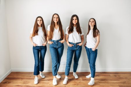four women white t shirt jeans