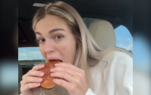 pregnant woman eating mcdonalds hamburger